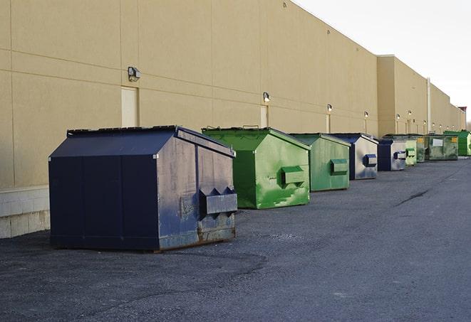 metal waste containers sit at a busy construction site in Archer, FL